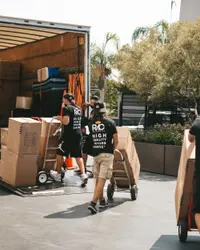 Major Moving crew loading boxes into a moving truck